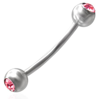Piercing s růžovými kuličkami